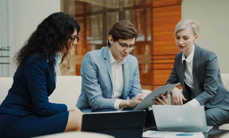 Three business people collaborating on a project